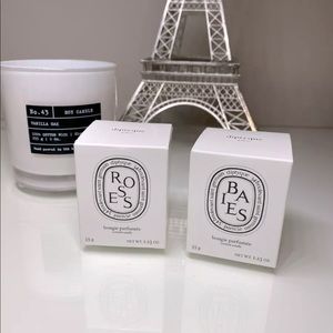 Two Diptyque Mini Candles